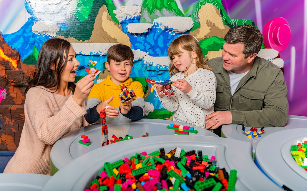Family building LEGO creations at LEGOLAND Windsor Resort.