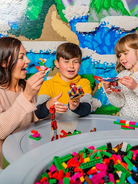 Family building LEGO creations at LEGOLAND Windsor Resort.