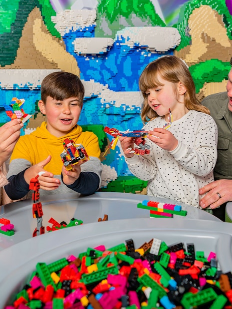 Family building LEGO creations at LEGOLAND Windsor Resort.