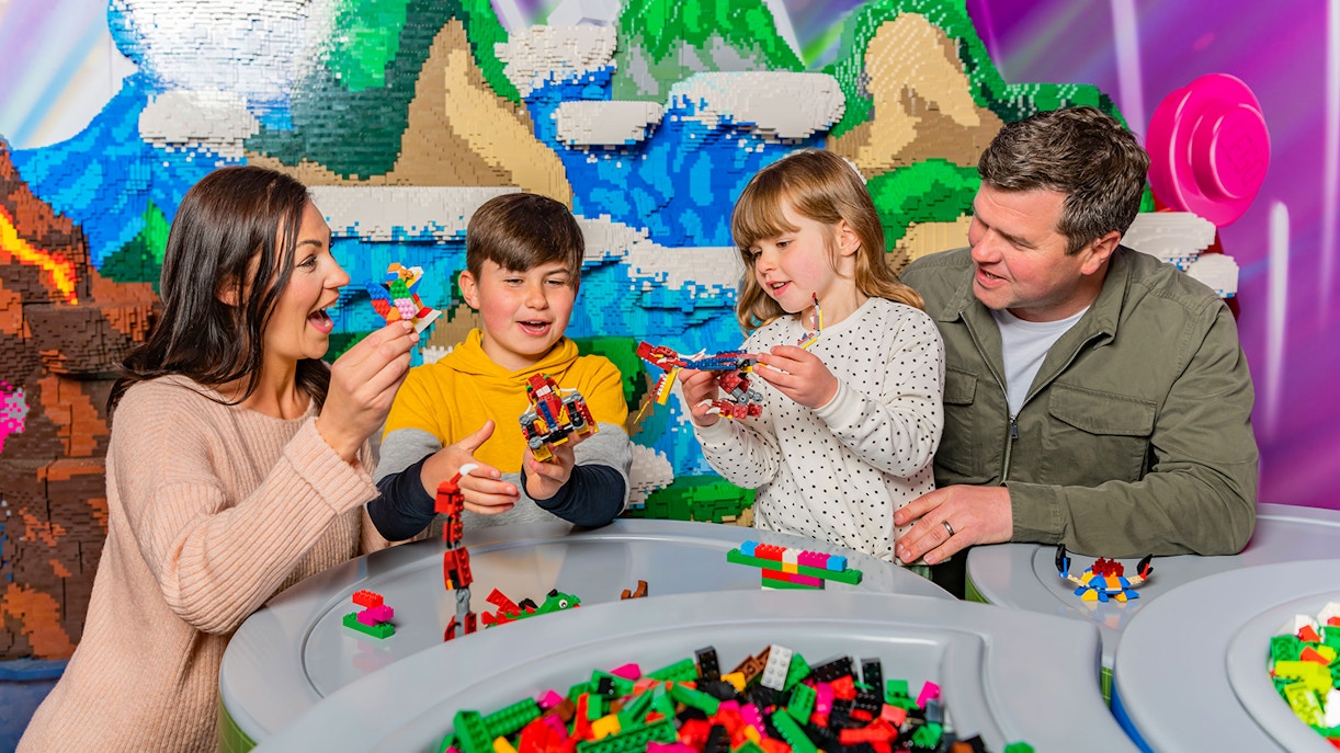 Family building LEGO creations at LEGOLAND Windsor Resort.