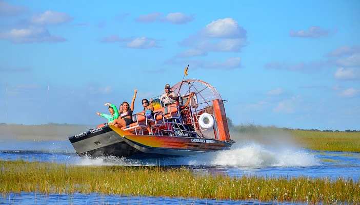 View of guests enjoying Airboat experience during Everglades Safari Park