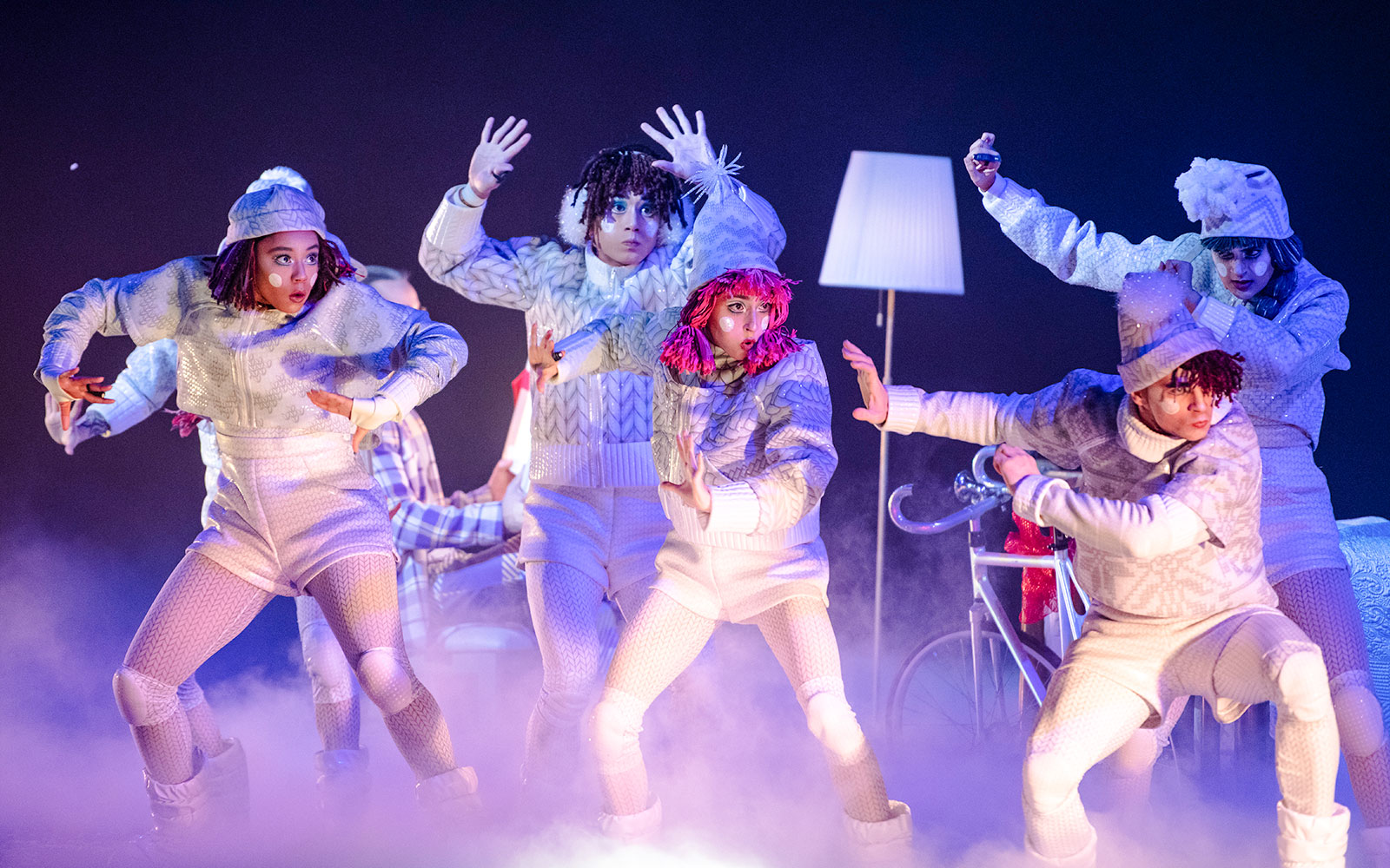 Performers in winter costumes during Cirque du Soleil's 'Twas The Night Before stage show.