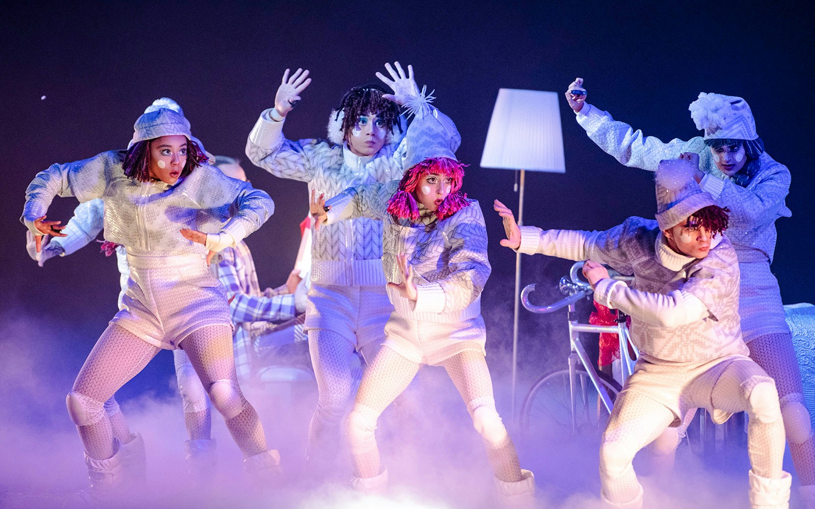 Performers in winter costumes during Cirque du Soleil's 'Twas The Night Before stage show.
