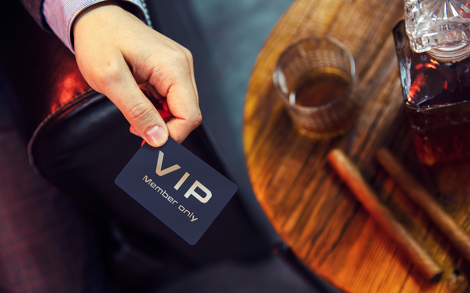 Man holds VIP member card