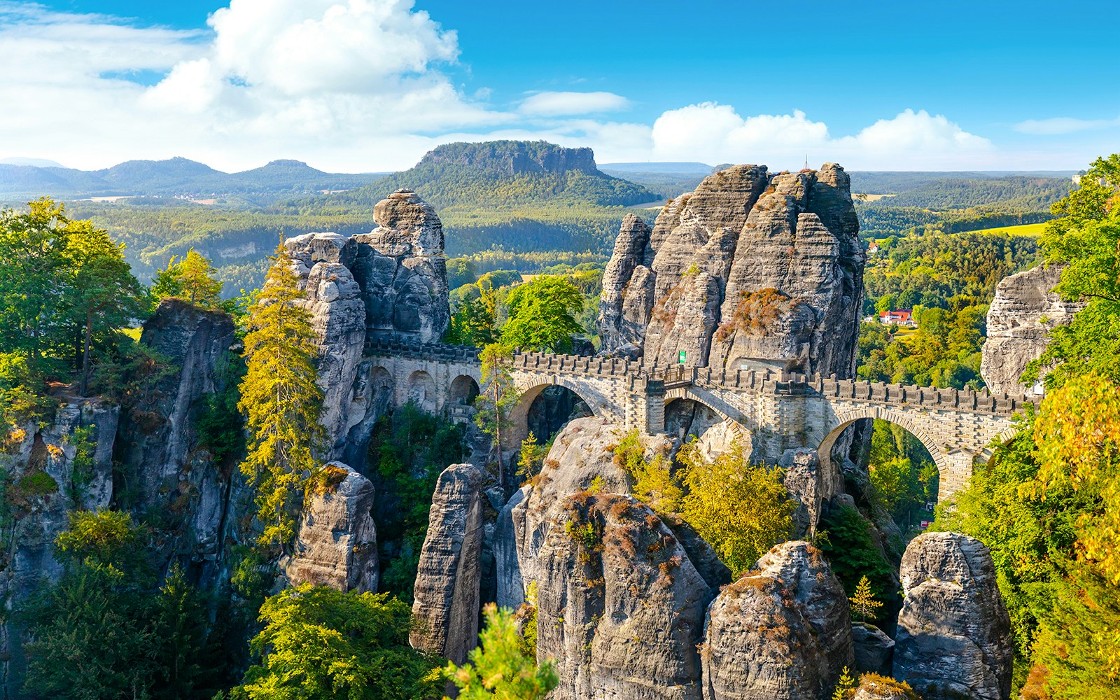 Panoramic view of the Bastei Bridge and rock formations in Saxon Switzerland, Germany.