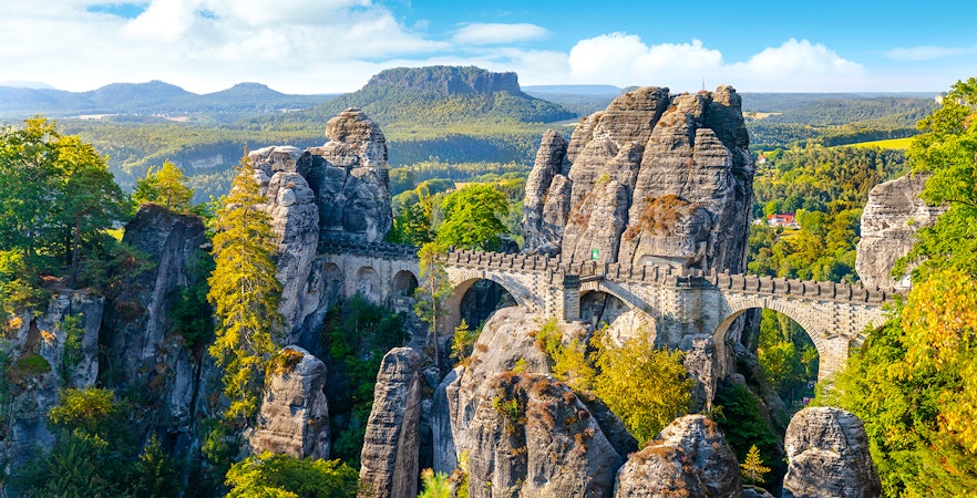 Panoramic view of the Bastei Bridge and rock formations in Saxon Switzerland, Germany.