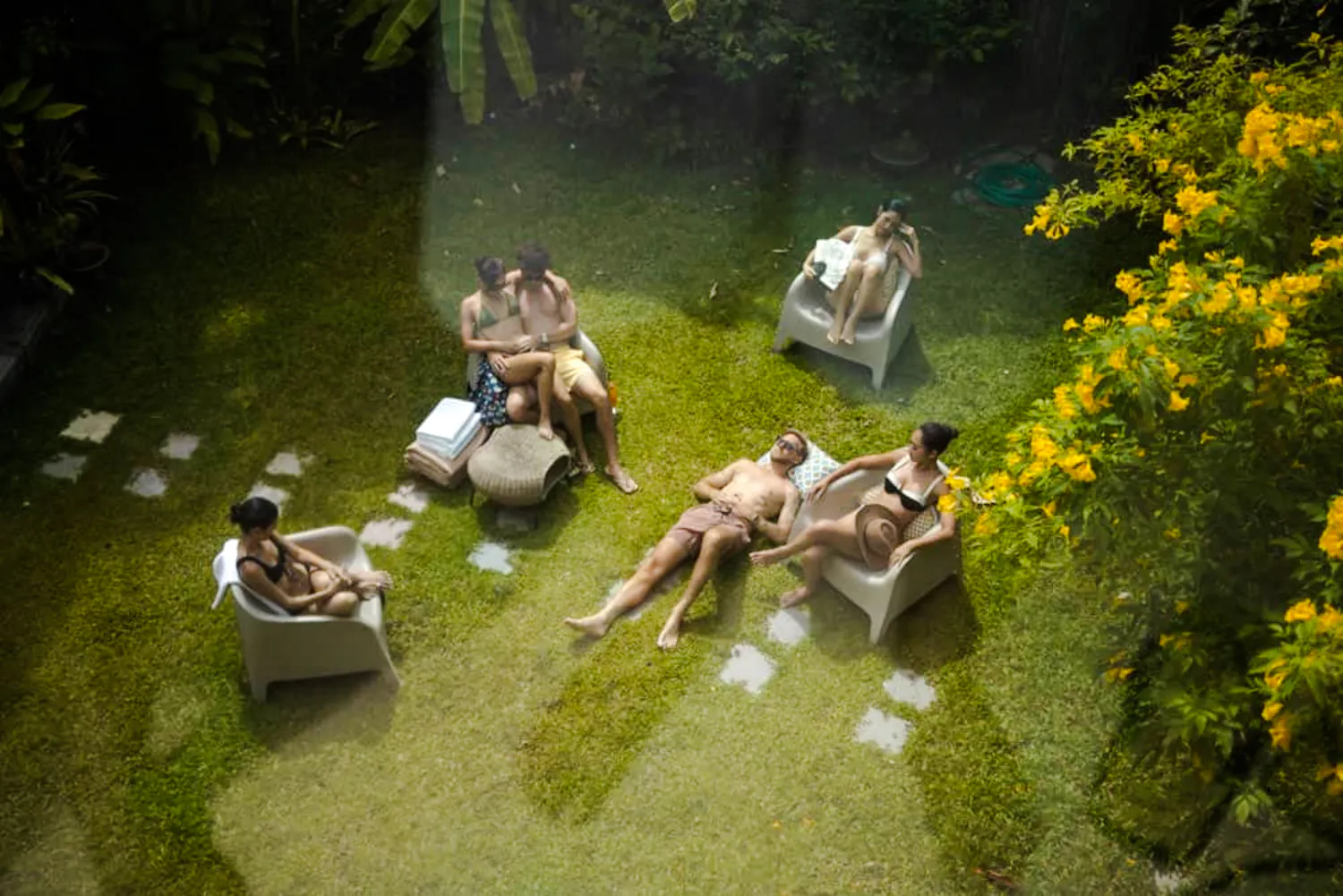 Visitors relaxing in the garden area of Yunomori Onsen & Spa, Pattaya.