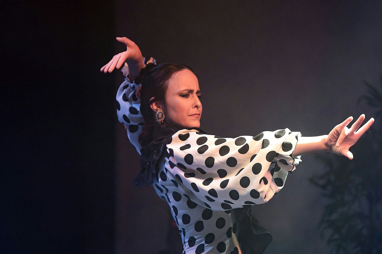 Flamenco dancer performing at Flamenco Laietana in polka dot dress.