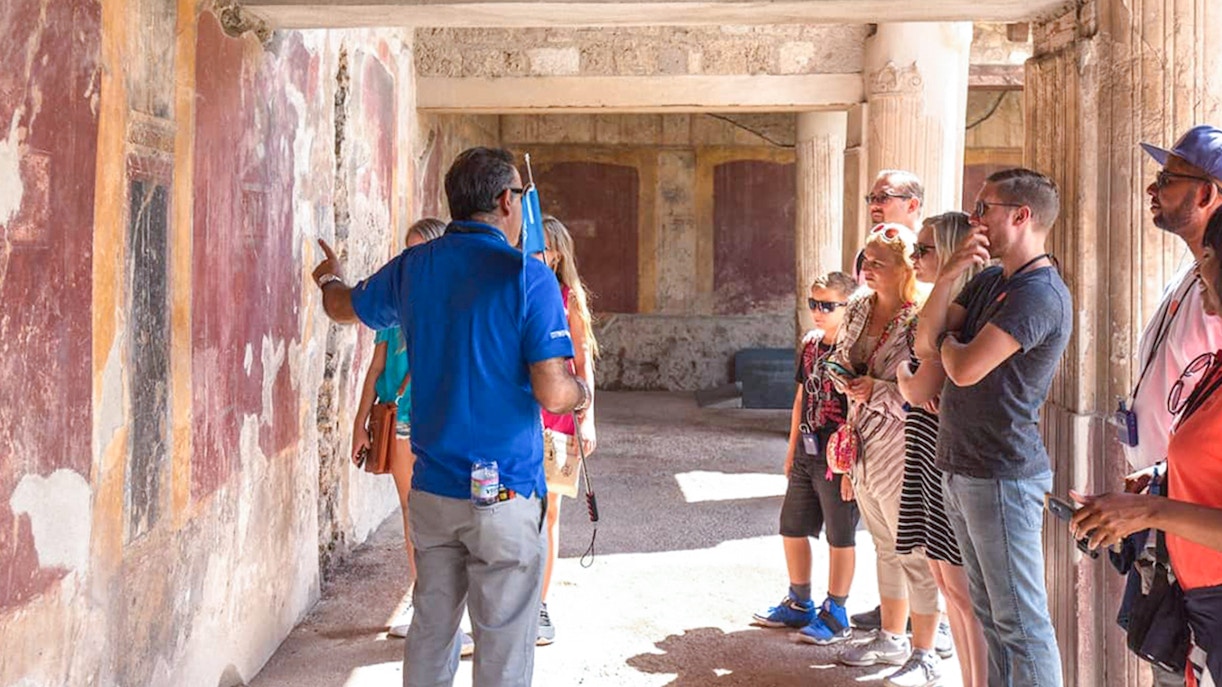 People with guide in pompeii