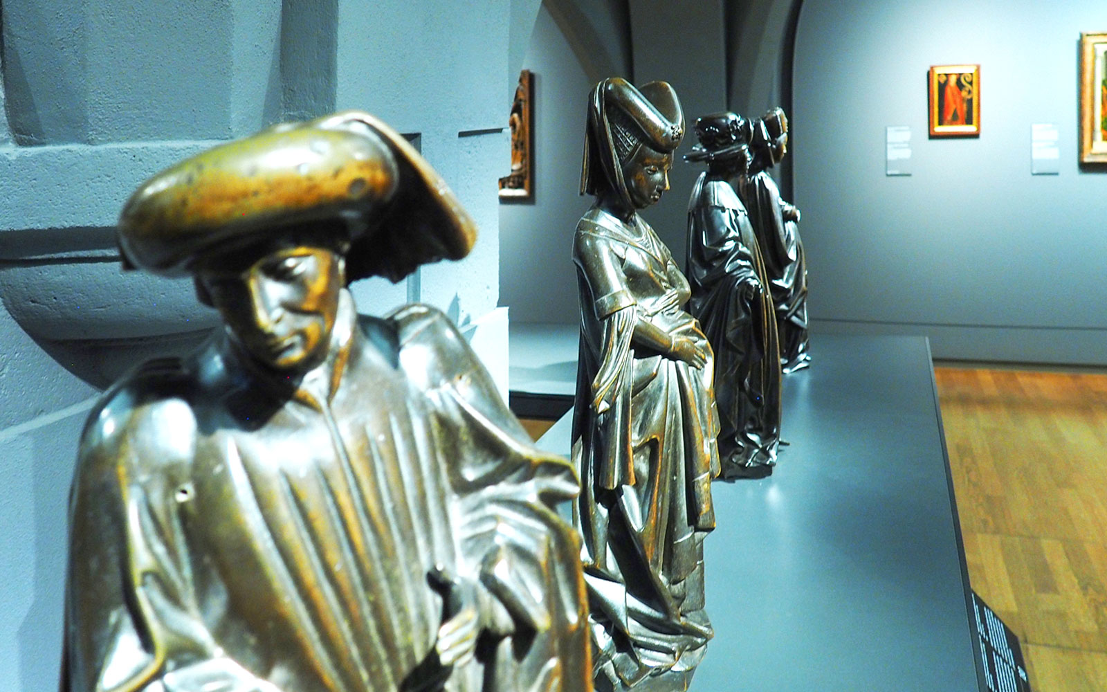 Bronze sculptures in the Rijksmuseum gallery during a private guided tour.