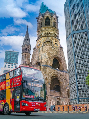 Berlin sightseeing bus in front of Kaiser Wilhelm Memorial Church.