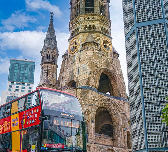 Berlin sightseeing bus in front of Kaiser Wilhelm Memorial Church.