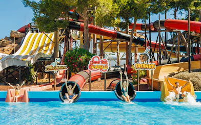 Visitors enjoying the Cola del Diablo water slide at Western Water Park.