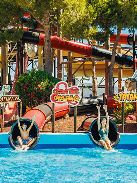 Visitors enjoying the Cola del Diablo water slide at Western Water Park.