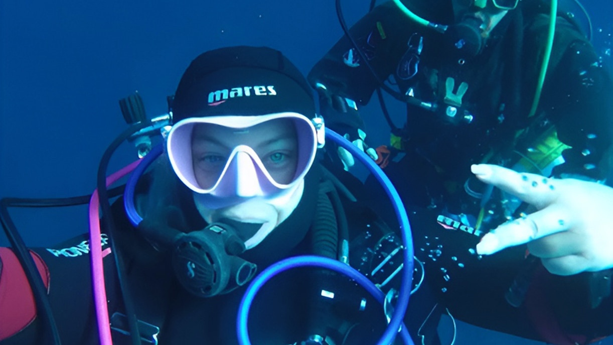 Certified divers exploring underwater