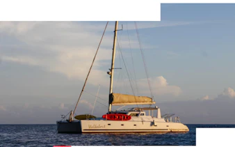 Sailing catamaran on a deep-sea fishing charter in Zanzibar waters.