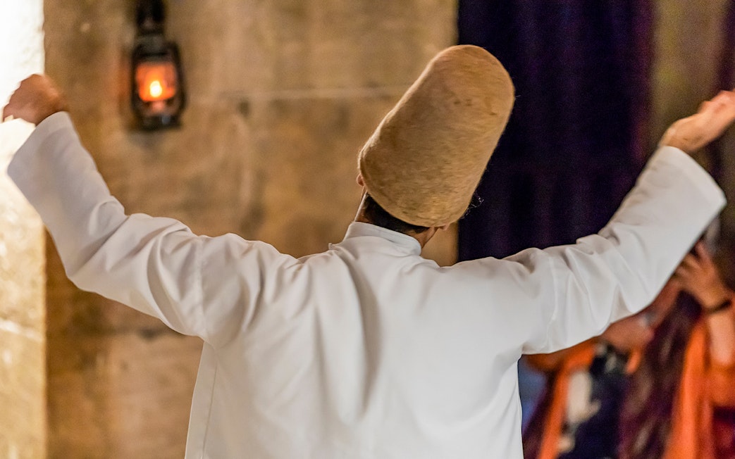 Whirling Dervish performing in Istanbul during Mevlevi Sema ceremony.