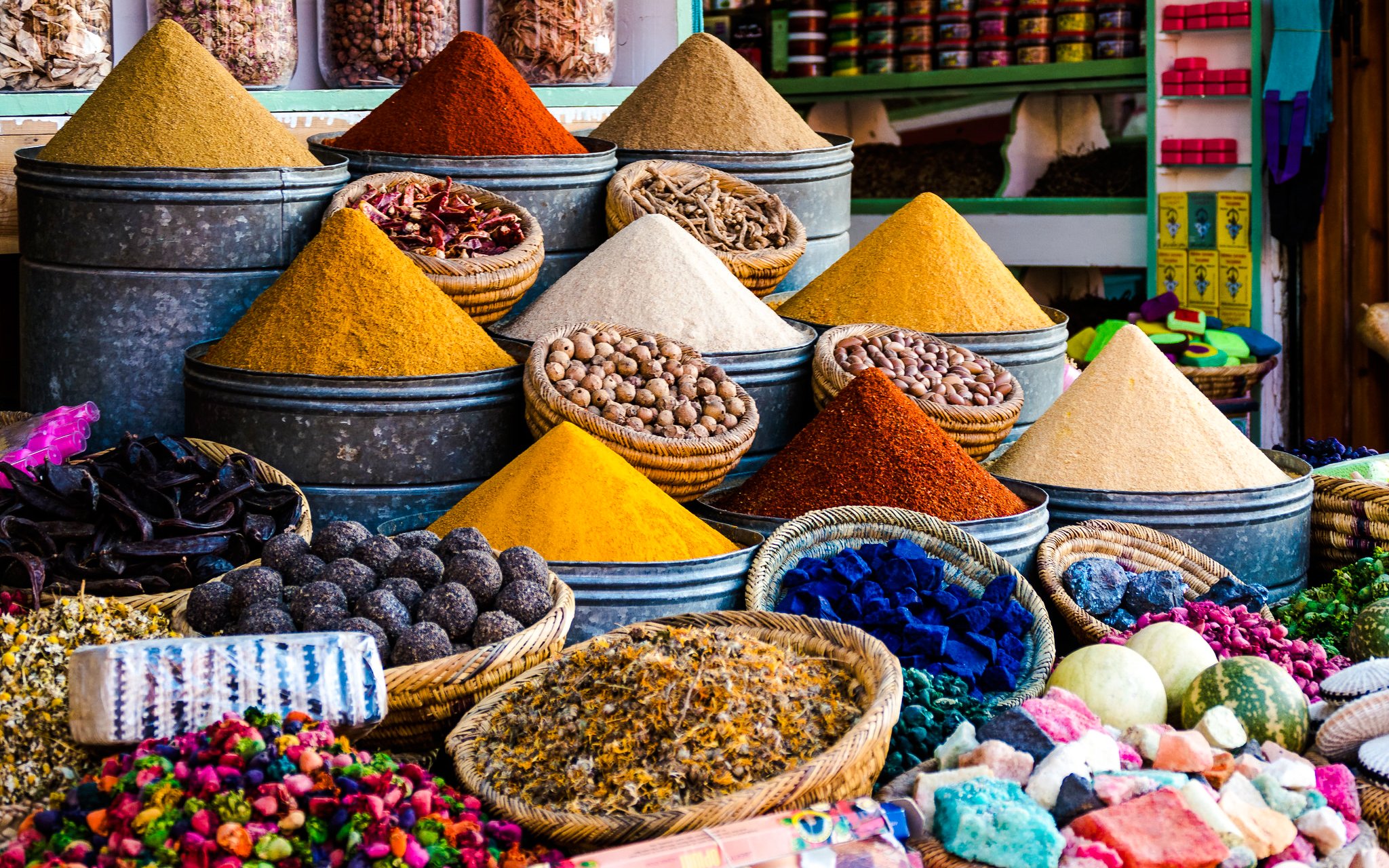 Spices in metal bins and baskets at a Marrakech souk.