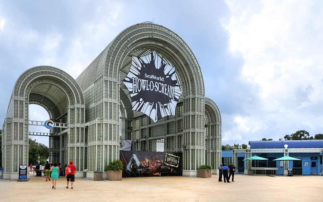 SeaWorld Howloscream entrance at Aquatica San Antonio, Texas with visitors approaching.