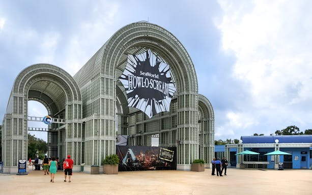 SeaWorld Howloscream entrance at Aquatica San Antonio, Texas with visitors approaching.