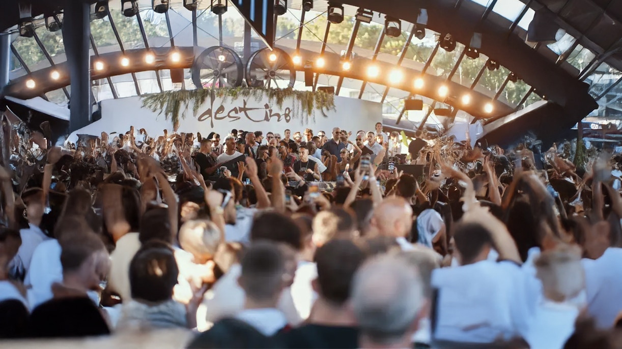 People dancing in a room during evening at a DJ Night