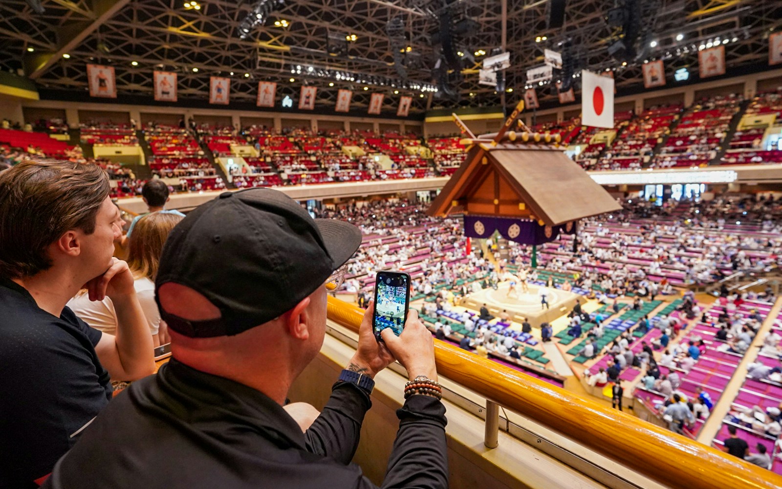 Spectators watching a sumo match at Ryogoku Kokugikan in Tokyo.