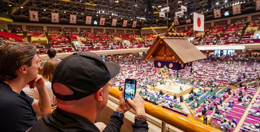 Spectators watching a sumo match at Ryogoku Kokugikan in Tokyo.