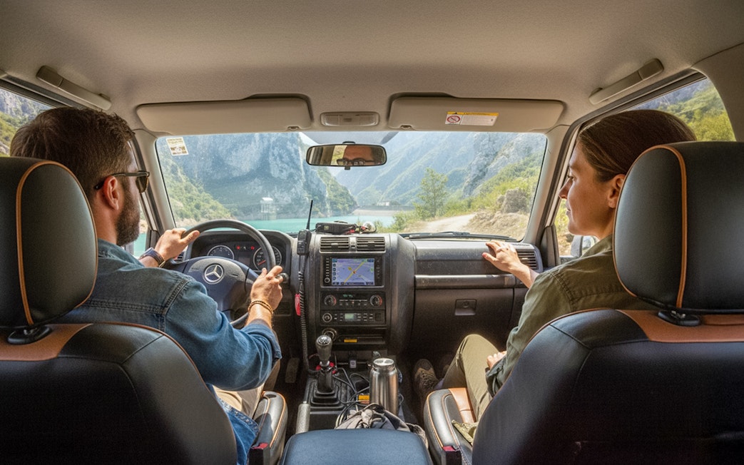 4x4 vehicle interior with Bovilla Lake view through windshield during offroad tour.