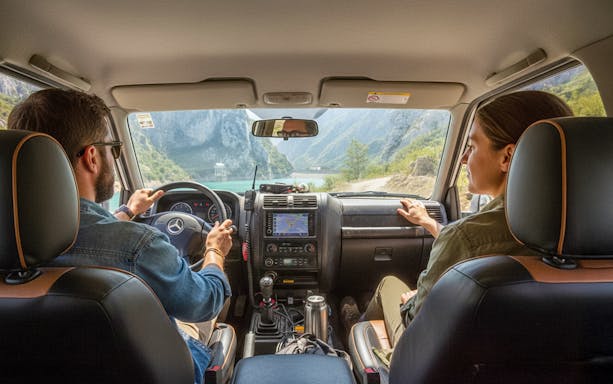 4x4 vehicle interior with Bovilla Lake view through windshield during offroad tour.
