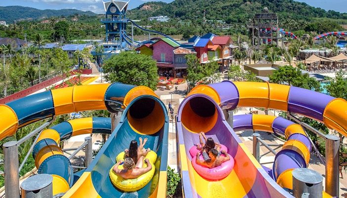 Visitors at the top of a waterslide at Andamanda Phuket, Thailand, preparing to slide down.