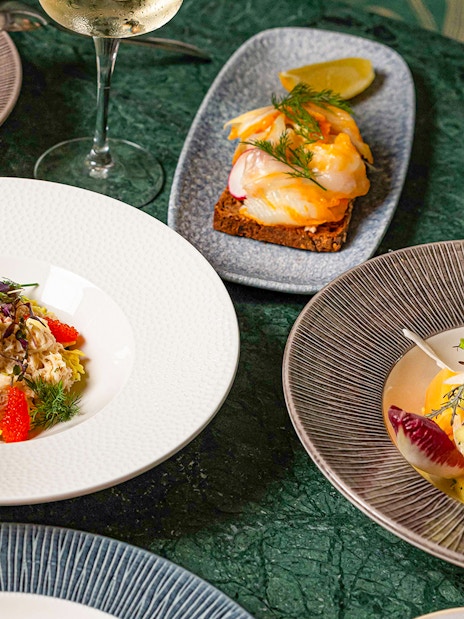 Dishes and wine at Flora Danica Paris on the Champs Elysées.