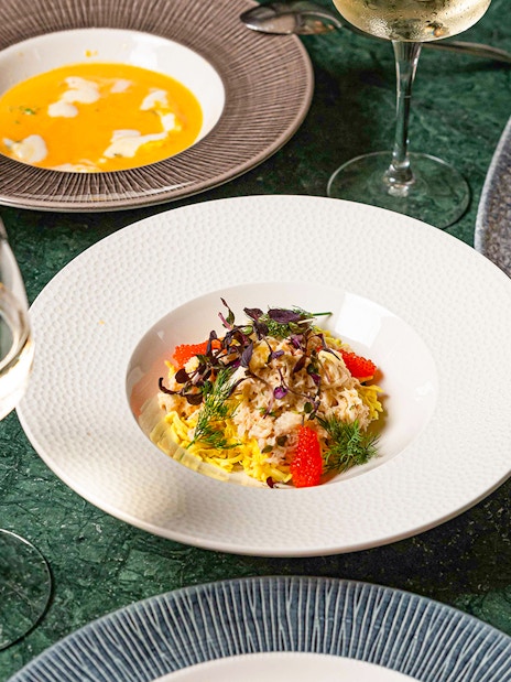 Dishes and wine at Flora Danica Paris on the Champs Elysées.