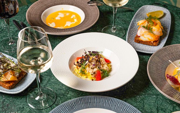 Dishes and wine at Flora Danica Paris on the Champs Elysées.