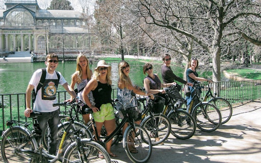 Group biking in front of Crystal Palace, Retiro Park, Madrid.