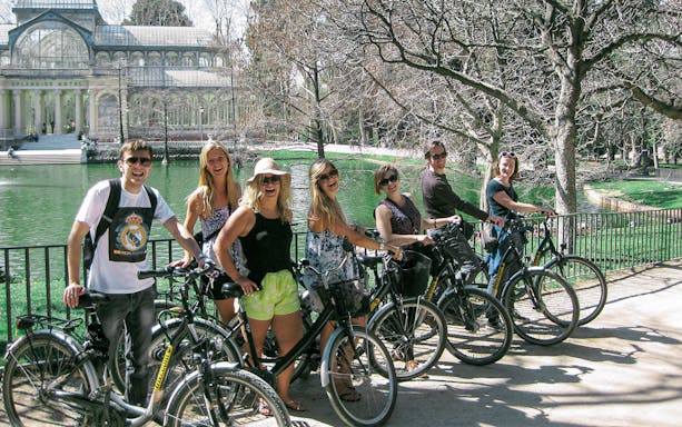 Group biking in front of Crystal Palace, Retiro Park, Madrid.
