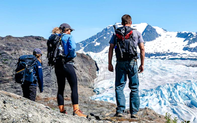 Hikers overlooking Mendenhall Glacier in Alaska.