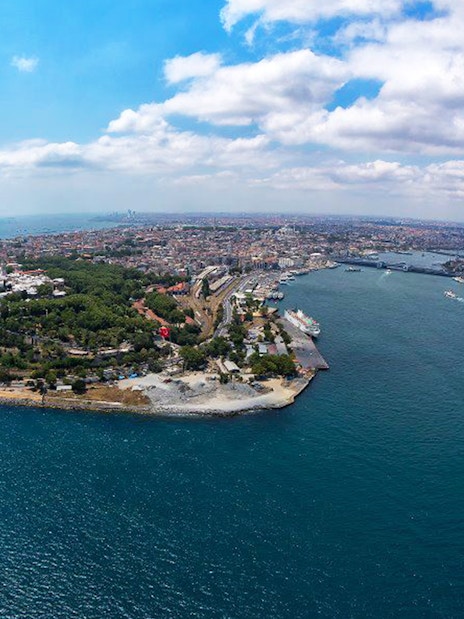 Aerial view of the Bosphorus Strait in Istanbul, Turkey, with a ferry crossing the water.