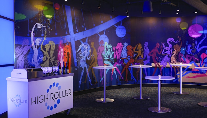 Dining area with colorful mural at Las Vegas High Roller Observation Wheel.