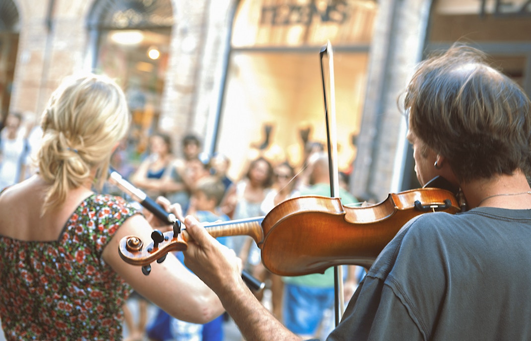 Performers of street artists violinist at Santo Stefano