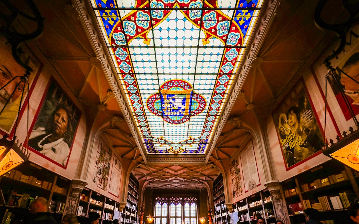Lello Library stained glass ceiling with colorful patterns in Porto, Portugal.