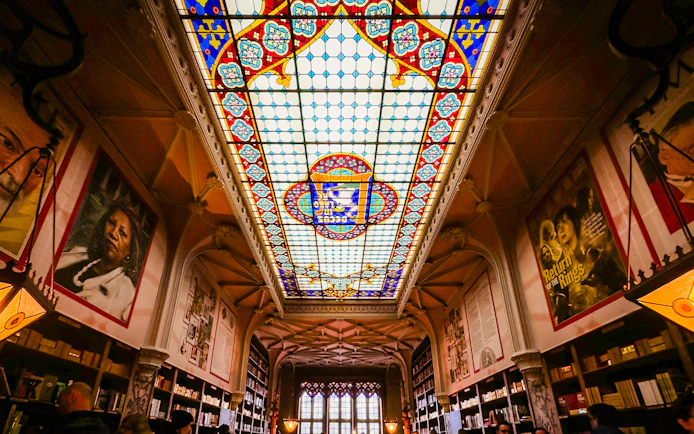 Lello Library stained glass ceiling with colorful patterns in Porto, Portugal.
