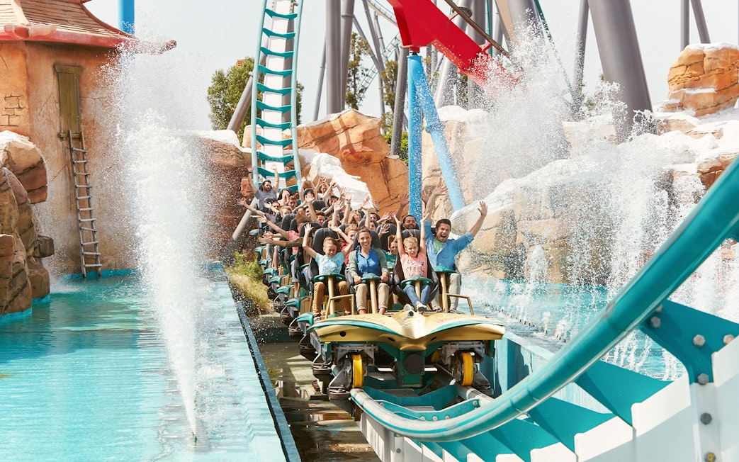 Visitors enjoying a water ride at PortAventura Park, Barcelona.