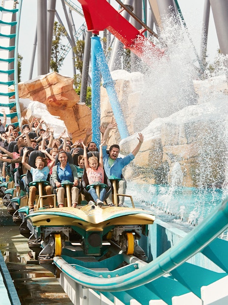 Visitors enjoying a water ride at PortAventura Park, Barcelona.