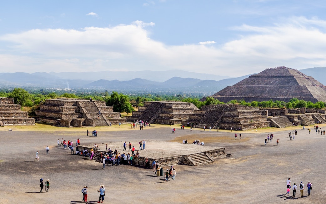 Avenue of the Dead with tourists, overlooking Pyramid of the Sun, Teotihuacan, Mexico.