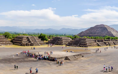Avenue of the Dead with tourists, overlooking Pyramid of the Sun, Teotihuacan, Mexico.