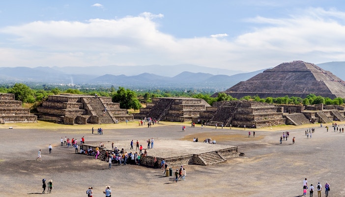 Avenue of the Dead with tourists, overlooking Pyramid of the Sun, Teotihuacan, Mexico.
