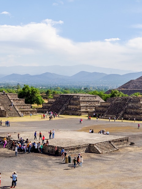 Avenue of the Dead with tourists, overlooking Pyramid of the Sun, Teotihuacan, Mexico.