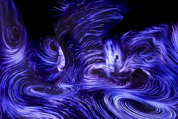 TeamLab art installation with floating spheres in Abu Dhabi exhibition space.