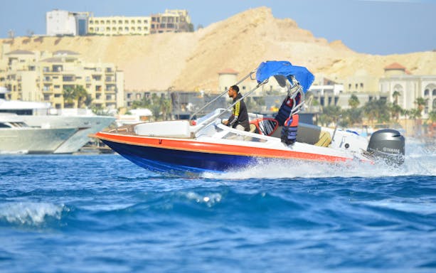 Private speedboat on the water near Dolphin House, suitable for up to six people.