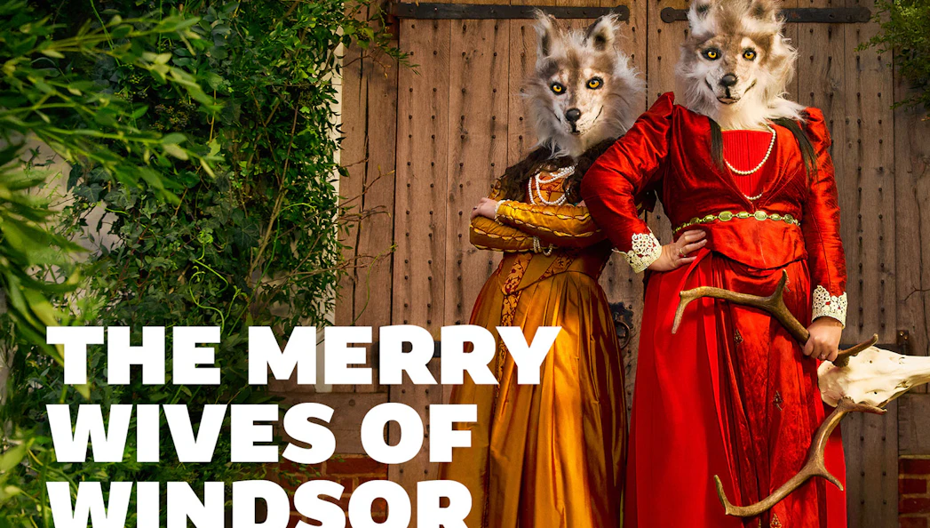Two people in wolf masks and period costumes for The Merry Wives of Windsor.